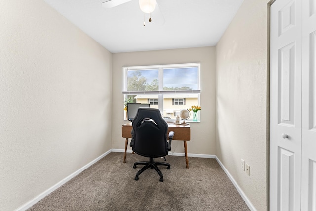 home office featuring carpet floors and ceiling fan