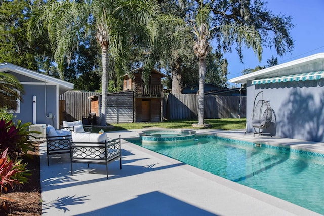 view of pool featuring an outdoor living space, a patio, and an in ground hot tub