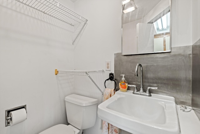 bathroom with sink and toilet