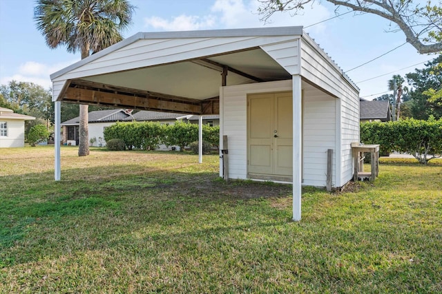 view of outbuilding featuring a yard