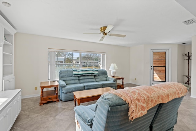 living room with light tile patterned floors and ceiling fan