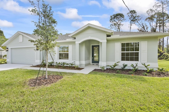 single story home with a garage and a front lawn