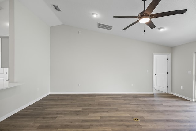 spare room with ceiling fan, hardwood / wood-style floors, and vaulted ceiling