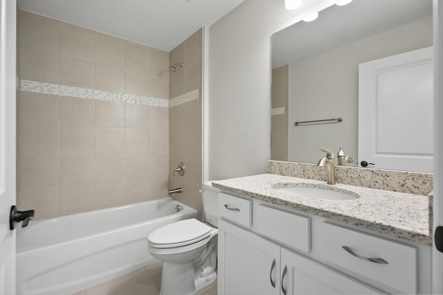 full bathroom featuring tile patterned floors, toilet, vanity, and tiled shower / bath