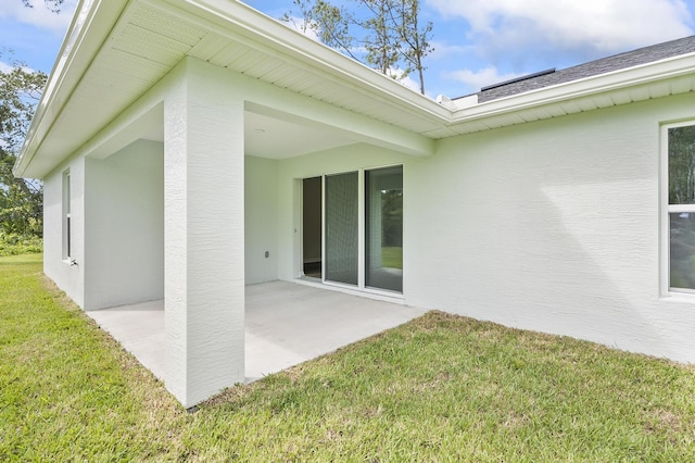 exterior space featuring a patio area and a yard