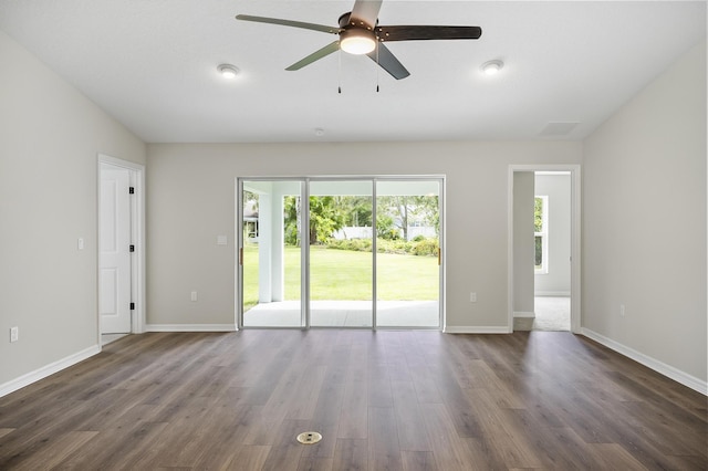 spare room with vaulted ceiling, ceiling fan, and dark hardwood / wood-style flooring