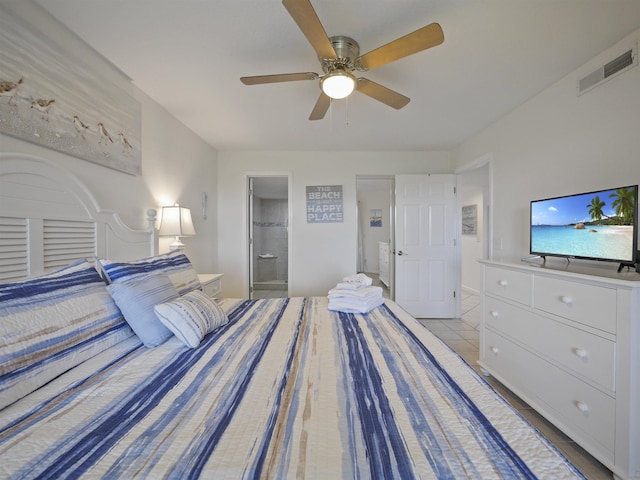 unfurnished bedroom featuring light tile patterned floors, ensuite bath, and ceiling fan