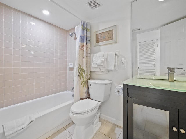 full bathroom featuring shower / bath combo with shower curtain, tile patterned flooring, vanity, and toilet