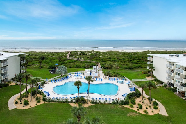 aerial view featuring a water view and a view of the beach