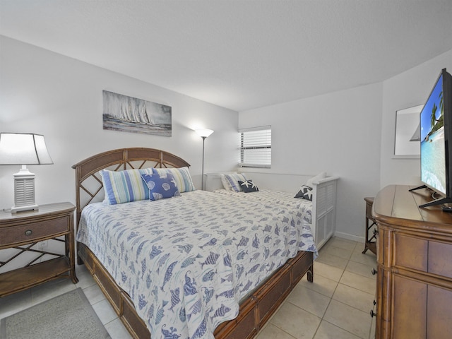 bedroom featuring light tile patterned flooring