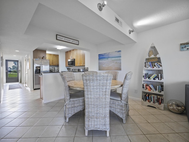 dining space with light tile patterned flooring