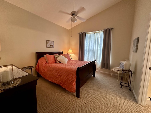 bedroom featuring light carpet, vaulted ceiling, and ceiling fan