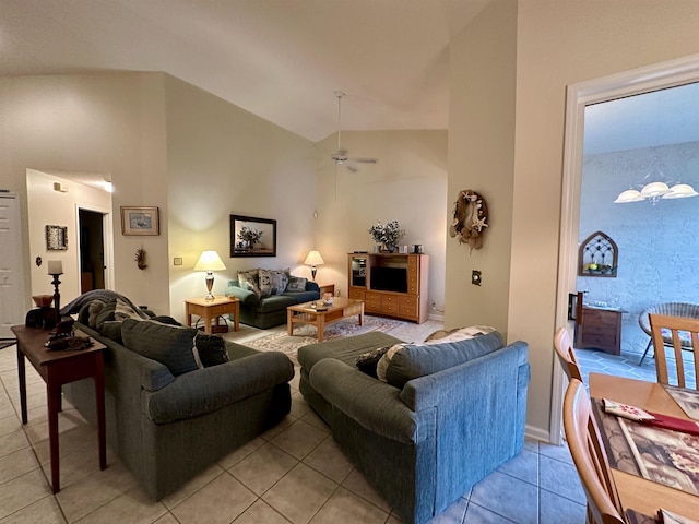 tiled living room featuring ceiling fan and high vaulted ceiling