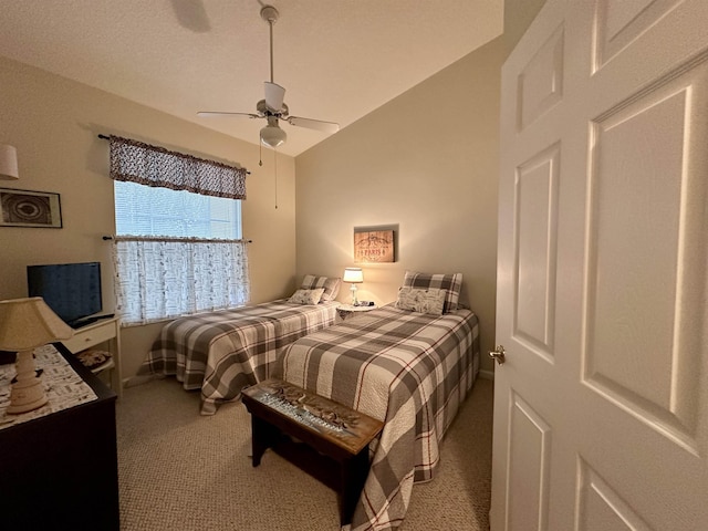 carpeted bedroom with ceiling fan and lofted ceiling