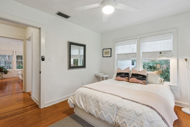 bedroom featuring ceiling fan and wood-type flooring