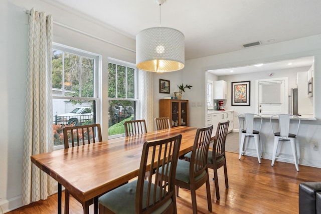 dining room with hardwood / wood-style flooring