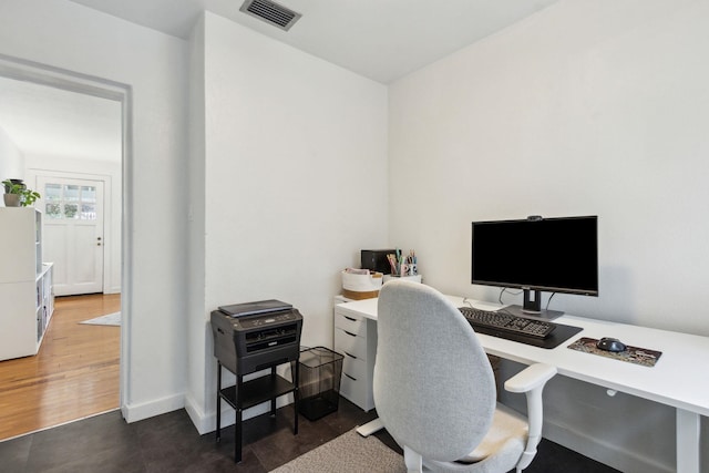 office space with dark wood-type flooring