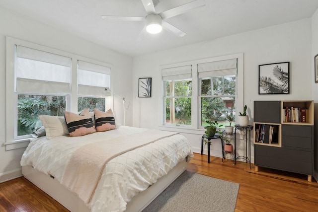 bedroom featuring hardwood / wood-style floors and ceiling fan