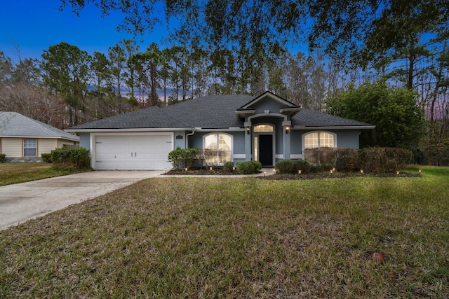 ranch-style house with a garage, driveway, a front lawn, and stucco siding