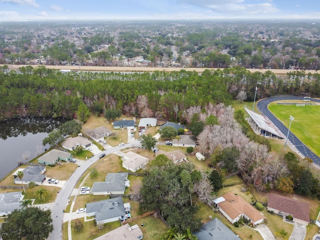 bird's eye view featuring a water view and a residential view