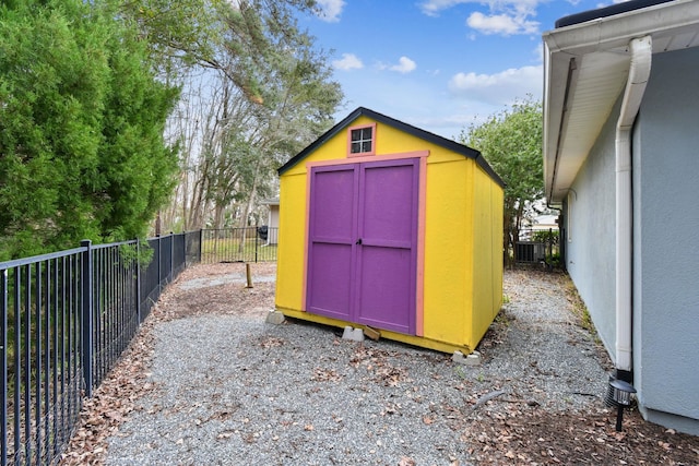 view of shed featuring central air condition unit and a fenced backyard