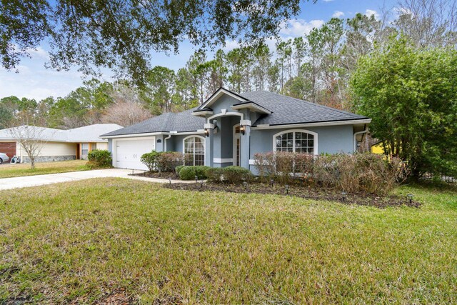 ranch-style house with a garage and a front lawn