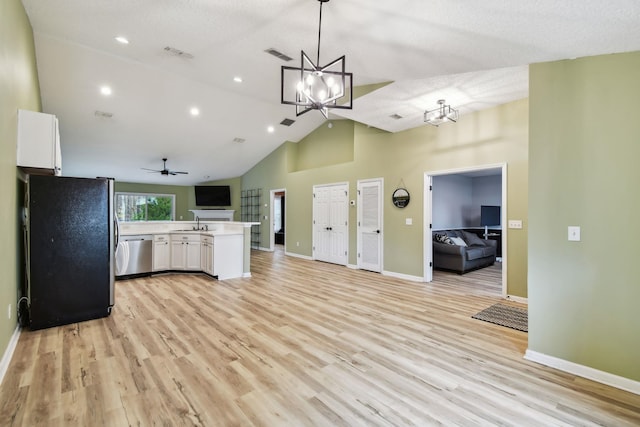 kitchen with stainless steel appliances, visible vents, light wood-style flooring, open floor plan, and white cabinetry