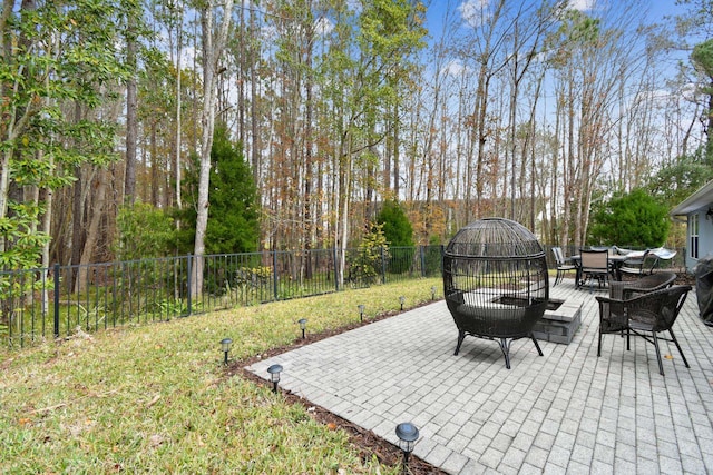 view of patio / terrace with an outdoor fire pit