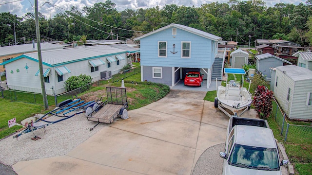 exterior space with a front yard and a carport