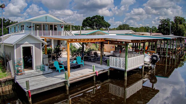 dock area with a deck with water view