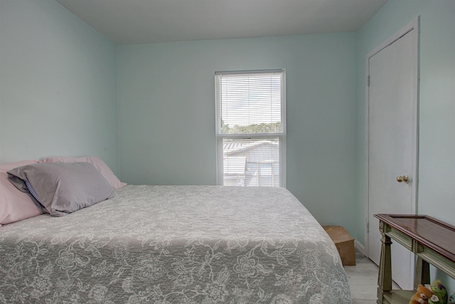 bedroom with light hardwood / wood-style flooring