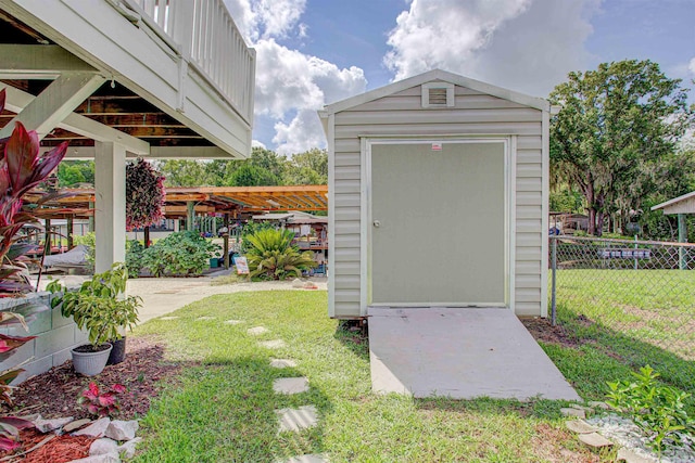 view of outbuilding featuring a yard