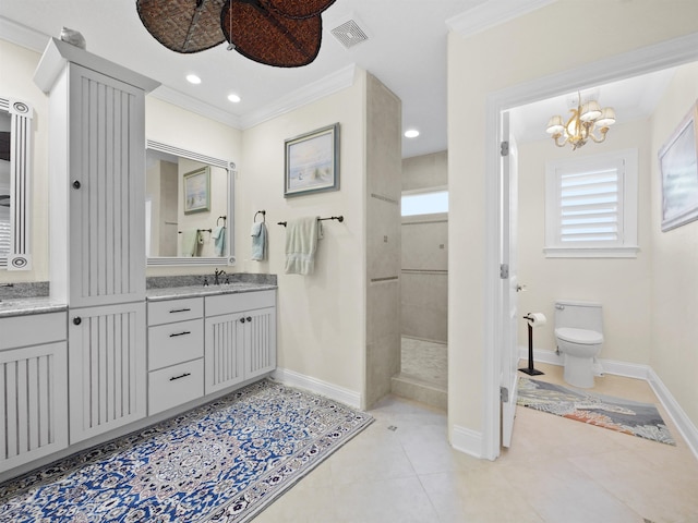 bathroom featuring tile patterned floors, vanity, a chandelier, and ornamental molding