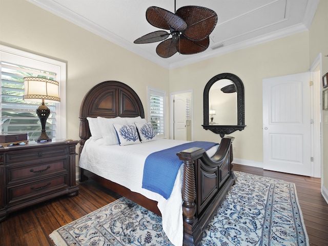 bedroom featuring ceiling fan, dark wood-type flooring, and ornamental molding