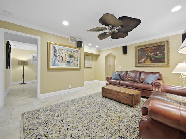 living room featuring ceiling fan and ornamental molding