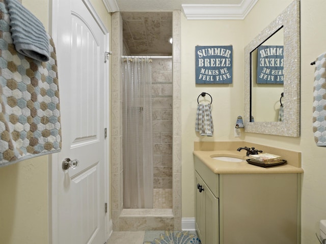 bathroom featuring a shower with curtain, crown molding, and vanity