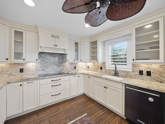 kitchen with tasteful backsplash, light stone counters, dishwasher, and dark wood-type flooring