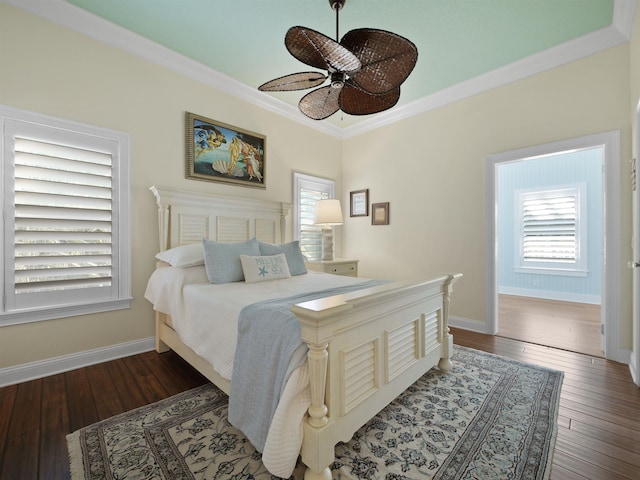 bedroom featuring ceiling fan, crown molding, and dark hardwood / wood-style floors