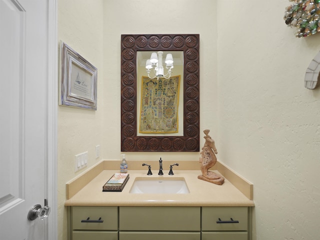 bathroom with vanity and an inviting chandelier