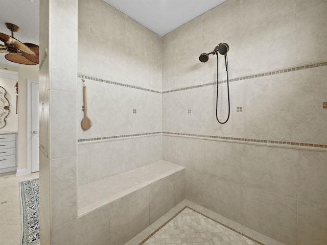 bathroom featuring tile patterned flooring, ceiling fan, and a tile shower