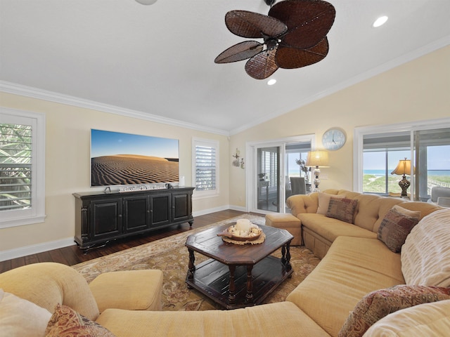 living room with plenty of natural light, dark wood-type flooring, and ornamental molding