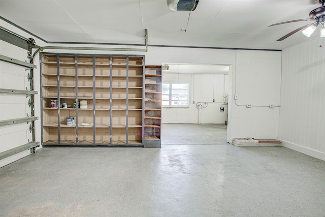 garage with a ceiling fan and a garage door opener