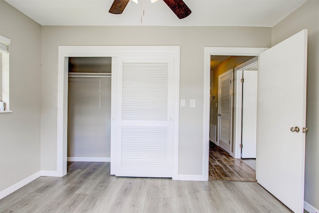 unfurnished bedroom with visible vents, baseboards, light wood-style floors, a closet, and ceiling fan