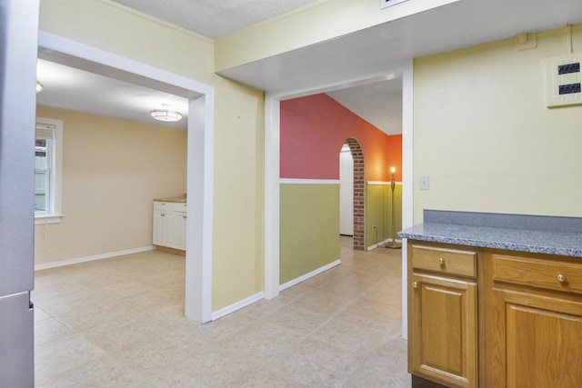 100 Spring St, Saint Augustine, FL 32084 - corridor featuring arched walkways and light tile patterned flooring