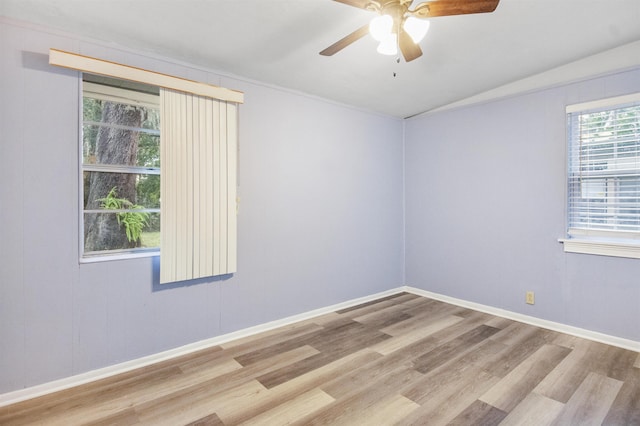 unfurnished room featuring light wood-type flooring, a wealth of natural light, and ceiling fan