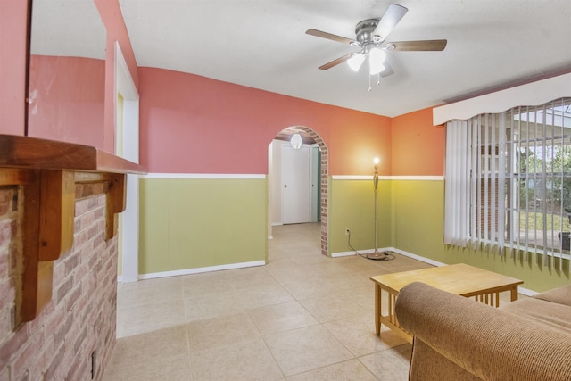 100 Spring St, Saint Augustine, FL 32084 - living area featuring arched walkways, a ceiling fan, and tile patterned floors