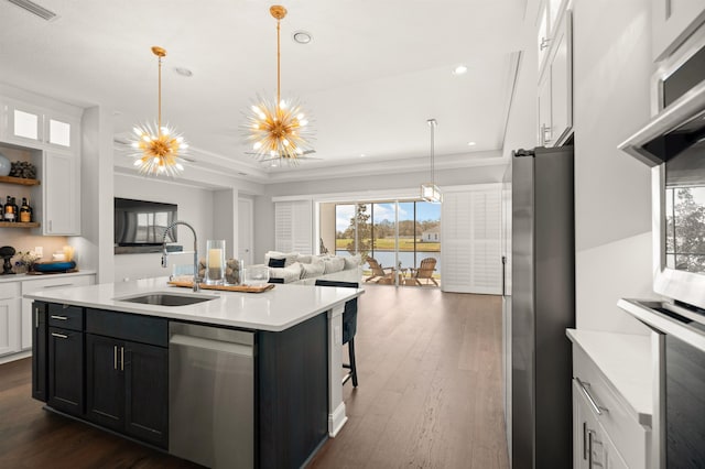 87 Amarante Ln, Saint Augustine, FL 32095 - kitchen with a sink, stainless steel appliances, light countertops, white cabinetry, and dark wood-style floors