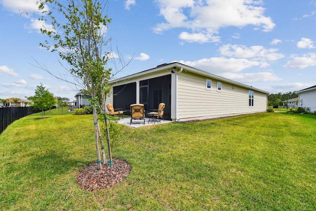 82 Lone Cypress Way, Saint Augustine, FL 32092 - back of property featuring a sunroom and a patio area