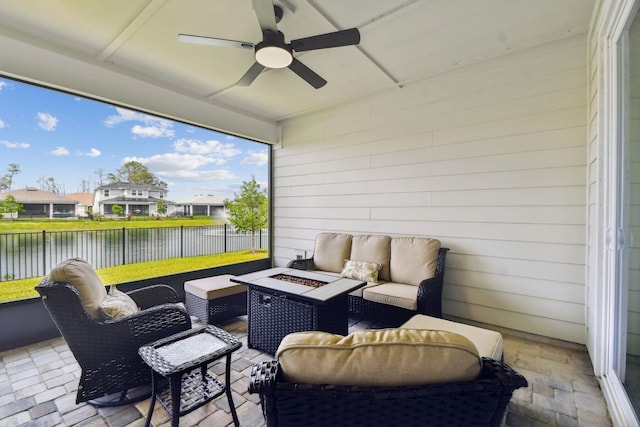 82 Lone Cypress Way, Saint Augustine, FL 32092 - fenced backyard featuring an outdoor living space with a fire pit, a water view, a ceiling fan, and a patio area