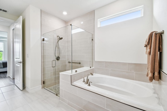 82 Lone Cypress Way, Saint Augustine, FL 32092 - bathroom with a bath, a shower stall, and tile patterned floors
